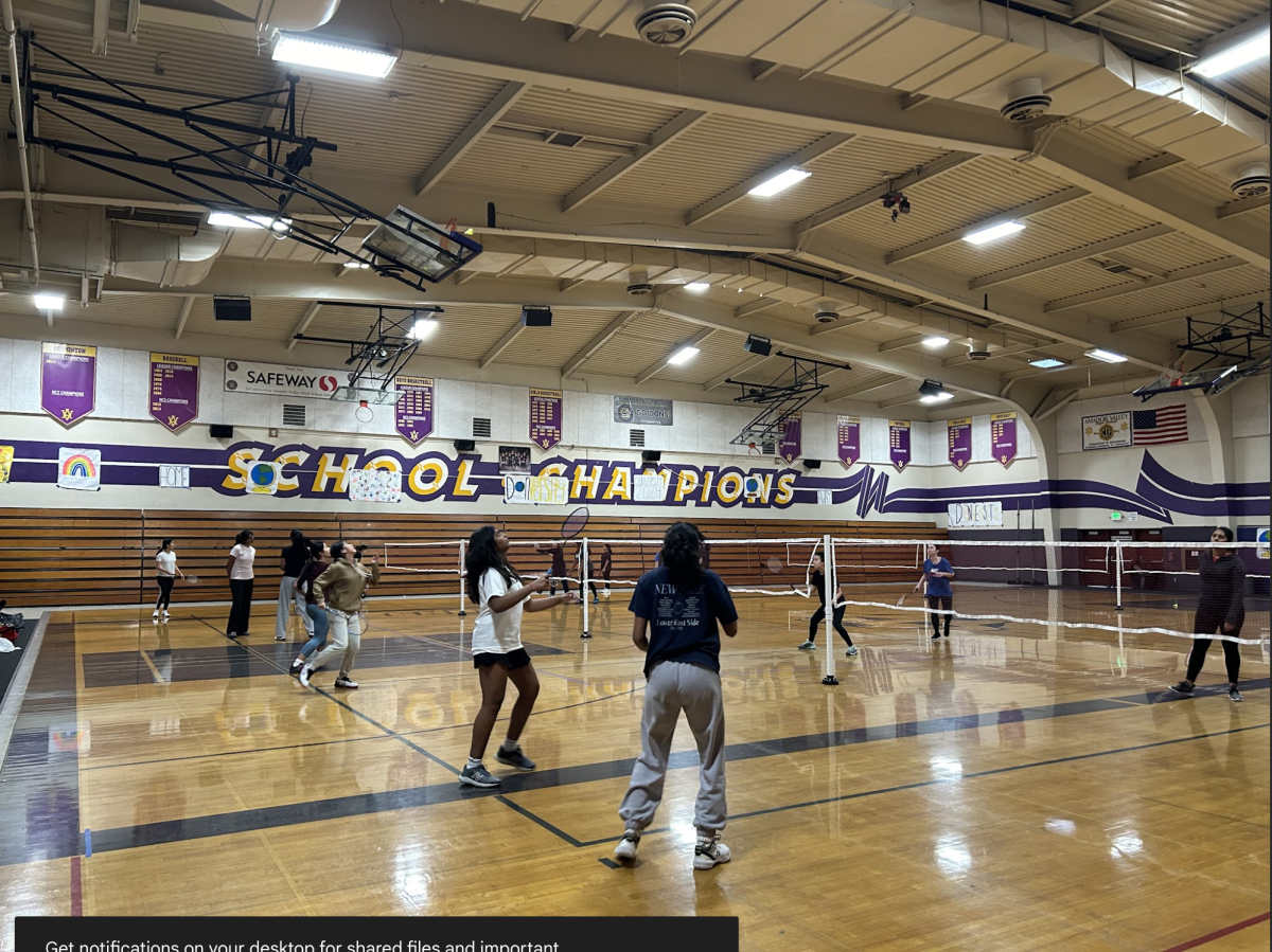 Badminton Club warms up with high intensity one-on-one matches.